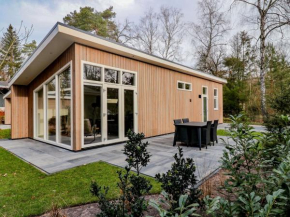 Modern chalet with a dishwasher, located on a pond